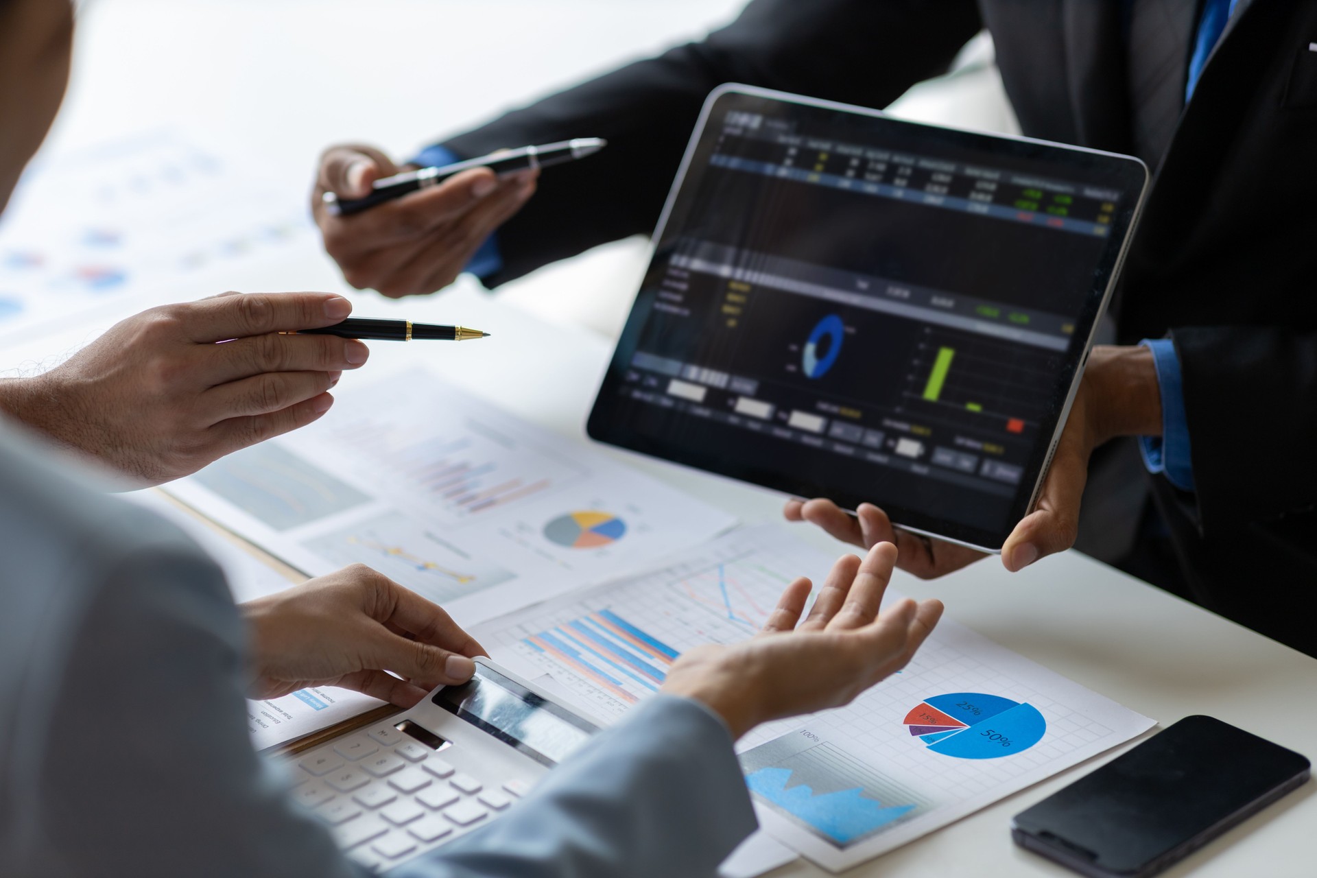 Business adviser meeting to analyze and discuss the situation on the financial report in the meeting room. Investment Consultant, Financial Consultant, Financial advisor and accounting concept.